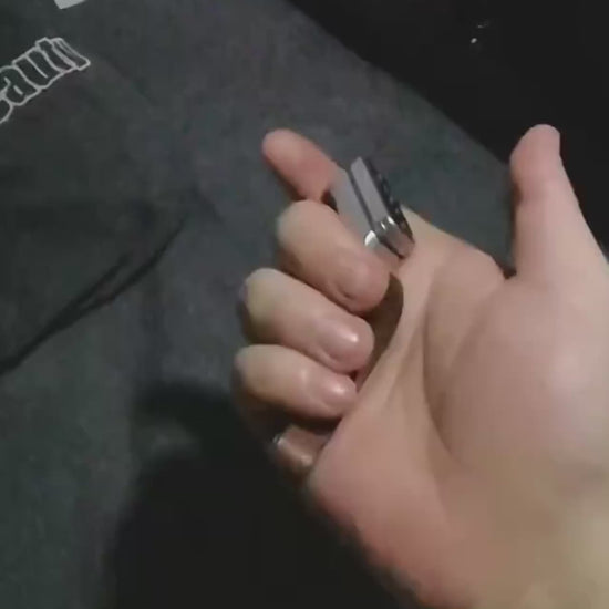 Metal fidget slider with magnetic push mechanism and tactile click feedback, designed for stress relief, focus support, and satisfying one-handed play, suitable as an everyday carry desk toy or keychain accessory.