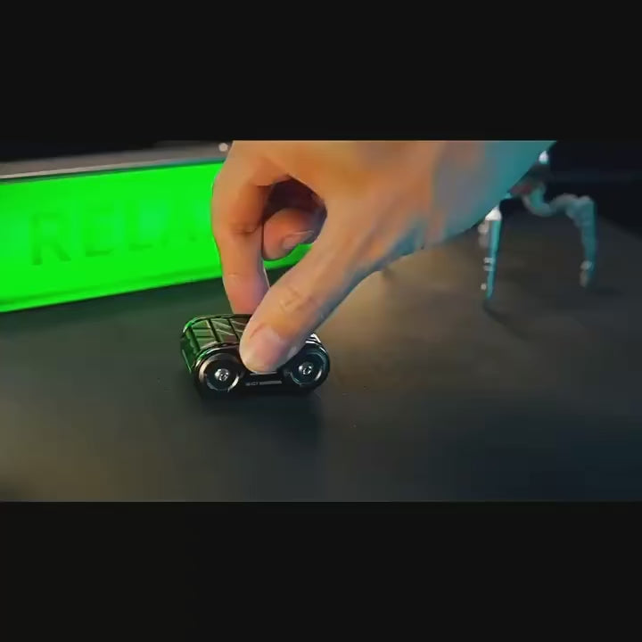 Armored metal decompression roller fidget with dual spinning wheels and layered mechanical design in black and blue finish