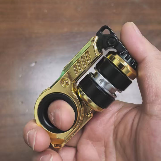 Mechanical EDC fidget slider object with ratchet mechanism and ring grip, metallic body with precision details, handheld scale, designed for tactile focus and stress relief