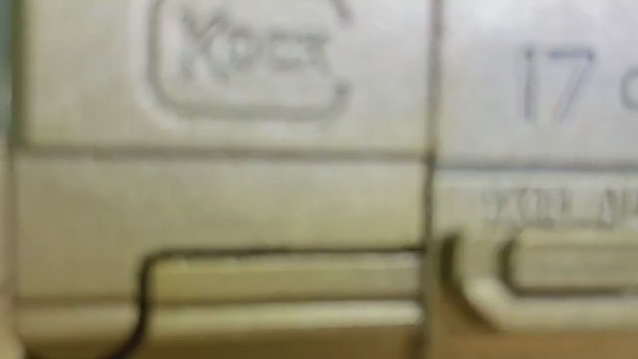 Exciting Portable Mini 3D Decompression Alloy Soft Bullet Pistol Toy - The Ultimate Birthday Gift for Boys and Outdoor Adventures Close-up video of a hand demonstrating a compact mini pistol with manual shooting action and ejectable shells