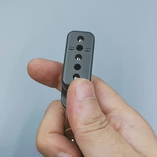 Metal fidget slider with magnetic push mechanism and tactile click feedback, designed for stress relief, focus support, and satisfying one-handed play, suitable as an everyday carry desk toy or keychain accessory.