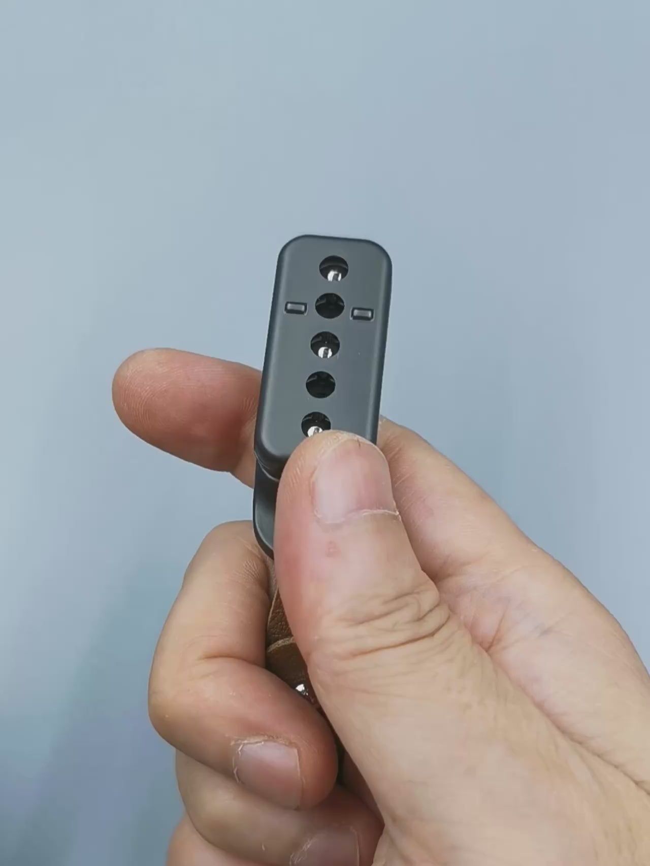 Metal fidget slider with magnetic push mechanism and tactile click feedback, designed for stress relief, focus support, and satisfying one-handed play, suitable as an everyday carry desk toy or keychain accessory.