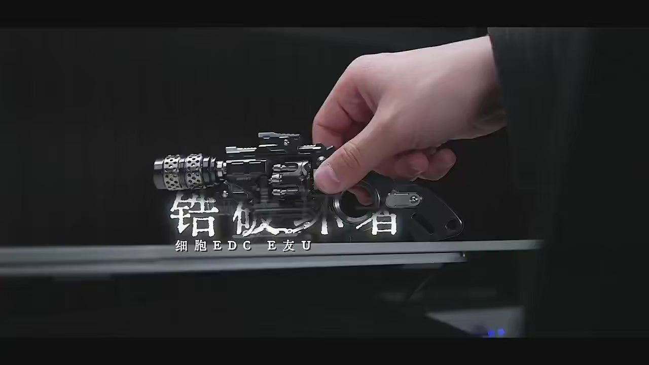 metal EDC fidget object designed with a pistol-inspired mechanical form, featuring exposed precision components, rotating elements, and modular construction for tactile interaction, focus, and stress relief.
